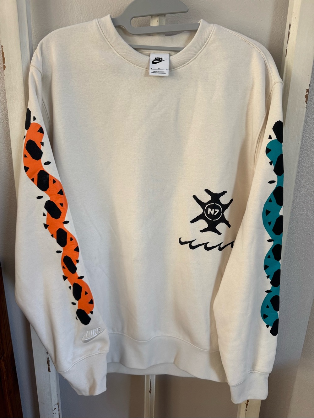 Nike Men's Cream Crewneck Sweatshirt with Orange & Teal Sleeve Graphics Medium